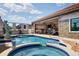 Outdoor pool and spa with built-in summer kitchen and custom statue at 13878 Allamanda Cir, Port Charlotte, FL 33981