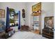 Comfortable room features a display case, unique decorations, and a bright window with a street view at 13878 Allamanda Cir, Port Charlotte, FL 33981