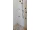 Modern shower featuring stone tile floors, multiple shower heads, and white stone walls at 13878 Allamanda Cir, Port Charlotte, FL 33981