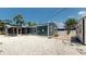 Backyard featuring an enclosed lanai, gravel, and a shed at 1402 Freemont S St, Gulfport, FL 33707