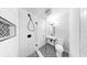 Modern bathroom with stylish walk-in shower, black fixtures, and patterned tile at 1402 Freemont S St, Gulfport, FL 33707