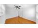 Bright bedroom featuring hardwood floors, a ceiling fan, and natural light at 1402 Freemont S St, Gulfport, FL 33707