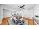 Open-concept dining area with modern decor, a stylish rug, and plenty of natural light at 1402 Freemont S St, Gulfport, FL 33707