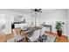 Open dining room with table set for six, next to the kitchen with tile floors at 1402 Freemont S St, Gulfport, FL 33707