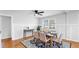 Open dining area with a table set for six under a ceiling fan, with tile floors at 1402 Freemont S St, Gulfport, FL 33707
