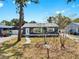 Inviting single-story home with a freshly painted exterior and tidy landscaping at 1402 Freemont S St, Gulfport, FL 33707