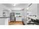 Bright kitchen featuring stainless steel appliances, granite countertops, and seamless flow at 1402 Freemont S St, Gulfport, FL 33707