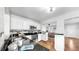 Bright kitchen with white cabinetry, a stainless steel sink, and an open view into the dining area at 1402 Freemont S St, Gulfport, FL 33707