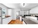 Stylish kitchen featuring white cabinets, black countertops, and tile backsplash at 1402 Freemont S St, Gulfport, FL 33707