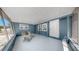 Enclosed Lanai with screened windows and seating perfect for relaxing at 1402 Freemont S St, Gulfport, FL 33707
