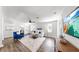 A modern living room featuring a comfortable white sofa, wood floors, and a ceiling fan at 1402 Freemont S St, Gulfport, FL 33707