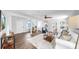 Living room features wood flooring, white walls, a ceiling fan, and lots of natural light at 1402 Freemont S St, Gulfport, FL 33707