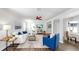 A cozy living room with comfortable seating, wood floors, white walls, and modern decor at 1402 Freemont S St, Gulfport, FL 33707