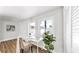 Bright home office with two windows, stylish decor, wood flooring, and a cozy chair at 1402 Freemont S St, Gulfport, FL 33707