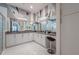 Bathroom featuring dual vanity sinks, decorative mirror, and glass door shower at 16106 Cedar Key Dr, Wimauma, FL 33598