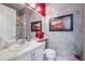 Stylish bathroom featuring decorative walls, framed art, and a glass-enclosed shower at 16106 Cedar Key Dr, Wimauma, FL 33598
