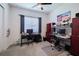 Home office space includes computer desks, sleek chairs, and organized storage at 16106 Cedar Key Dr, Wimauma, FL 33598