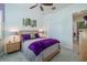 Bedroom with a ceiling fan, artwork on the wall, and a closet at 16106 Cedar Key Dr, Wimauma, FL 33598