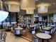 Bright dining area features ample seating, pendant lighting, and a comfortable atmosphere at 16106 Cedar Key Dr, Wimauma, FL 33598