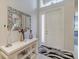 Light and bright entryway featuring neutral walls and modern accents at 16106 Cedar Key Dr, Wimauma, FL 33598