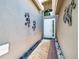 Entryway shows a brick floor, decorations, and a light-colored wall at 16106 Cedar Key Dr, Wimauma, FL 33598