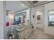 Foyer features decorative walls with a mirrored console table at 16106 Cedar Key Dr, Wimauma, FL 33598