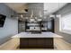 Modern kitchen island with stainless steel appliances, ample counter space and lots of room for cooking at 16106 Cedar Key Dr, Wimauma, FL 33598