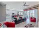 Open-concept living room and kitchen with modern decor, patio doors and center island at 16106 Cedar Key Dr, Wimauma, FL 33598
