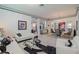Expansive living room with open layout, modern decor, and dining area, perfect for entertaining at 16106 Cedar Key Dr, Wimauma, FL 33598
