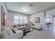 Modern living room featuring stylish decor, sleek furniture, and an open floor plan at 16106 Cedar Key Dr, Wimauma, FL 33598