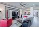 Spacious living room features modern fireplace, tray ceiling, and modern decor at 16106 Cedar Key Dr, Wimauma, FL 33598