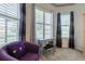 Sitting area with large windows and a comfortable chair and view at 16106 Cedar Key Dr, Wimauma, FL 33598