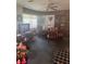 Traditional dining area with vintage furniture and bright lace curtains on the windows at 1710 26Th S Ave, St Petersburg, FL 33712