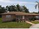Charming single-story home with a combination of stucco and stone finishes at 1710 26Th S Ave, St Petersburg, FL 33712