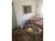 Basic living room with a dated sofa, a glass coffee table, and minimal decor at 1710 26Th S Ave, St Petersburg, FL 33712