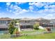 A screened-in porch, fenced yard and a manicured lawn create a private outdoor space at 1830 Nature View Dr, Lutz, FL 33558