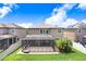 Relax and unwind in this screened-in patio overlooking the lush, green backyard at 1830 Nature View Dr, Lutz, FL 33558