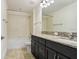 Bathroom features granite countertops, a shower-tub combo, and modern fixtures at 1830 Nature View Dr, Lutz, FL 33558
