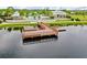 Aerial view of the community's dock and seating area on the lake, perfect for enjoying the waterfront scenery at 1830 Nature View Dr, Lutz, FL 33558