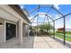 Covered patio with brick pavers, ceiling fans, and a beautiful backyard view at 1830 Nature View Dr, Lutz, FL 33558