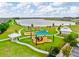 Scenic community playground overlooking a tranquil lake, offering a serene and Gathering-friendly atmosphere at 1830 Nature View Dr, Lutz, FL 33558