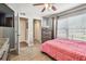 Bright bedroom with hardwood floors, gray walls, and a modern furniture set at 1939 Heartland Cir, Valrico, FL 33594