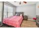 Cozy bedroom with neutral walls, hardwood floor and large window at 1939 Heartland Cir, Valrico, FL 33594