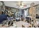 Home office featuring unique decor, hardwood floors, ceiling fan and lots of natural light at 1939 Heartland Cir, Valrico, FL 33594