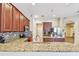 Open-concept kitchen featuring granite countertops, stainless steel appliances, and ample cabinet space at 1939 Heartland Cir, Valrico, FL 33594