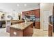 Kitchen with a center island, dark wood cabinets, granite countertops, and stainless steel appliances at 1939 Heartland Cir, Valrico, FL 33594