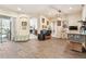 Open-concept living room with hardwood floors, neutral walls and access to outdoor living at 1939 Heartland Cir, Valrico, FL 33594