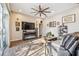 Spacious living room with hardwood floors, ceiling fan, fireplace and sliding glass doors to patio at 1939 Heartland Cir, Valrico, FL 33594