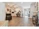 Spacious living room with wood-look flooring, neutral color, and access to the foyer at 1939 Heartland Cir, Valrico, FL 33594