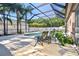 Inviting screened-in pool area with lounge chairs and lush landscaping, perfect for relaxing outdoors at 1939 Heartland Cir, Valrico, FL 33594